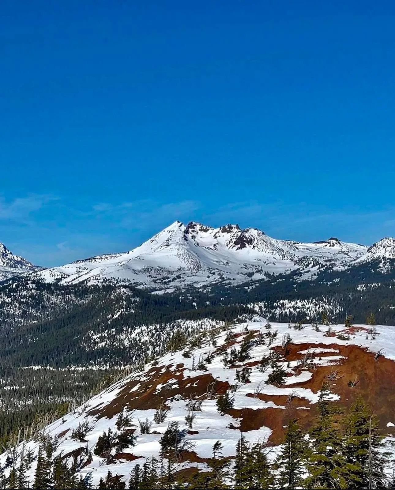 Broken Top's summit rock and snow, seen from the trail.